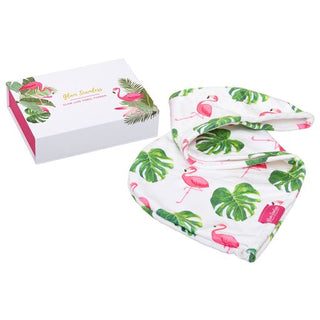 A pink flamingo print bandana placed next to a gift box is ideal for accessorizing hair extensions with a vibrant touch.
