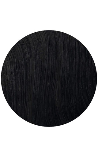 Jet black highlighted hair extensions on a white background with hand flowing through the hair.