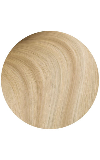 Rooted vanilla cream highlights a swatch of hair strand example on a white background