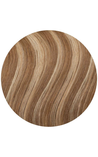 A circle showcasing wavy hair extensions in various shades of brown.