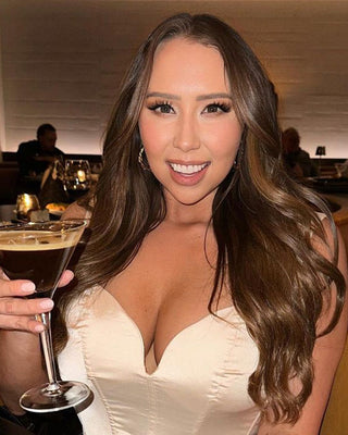 A woman with luxurious bronze brown hair extensions from Glam Seamless.