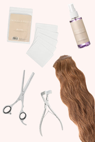 Hand-tied tape-in Pro Starter Kit with various hair extension tools and accessories displayed.